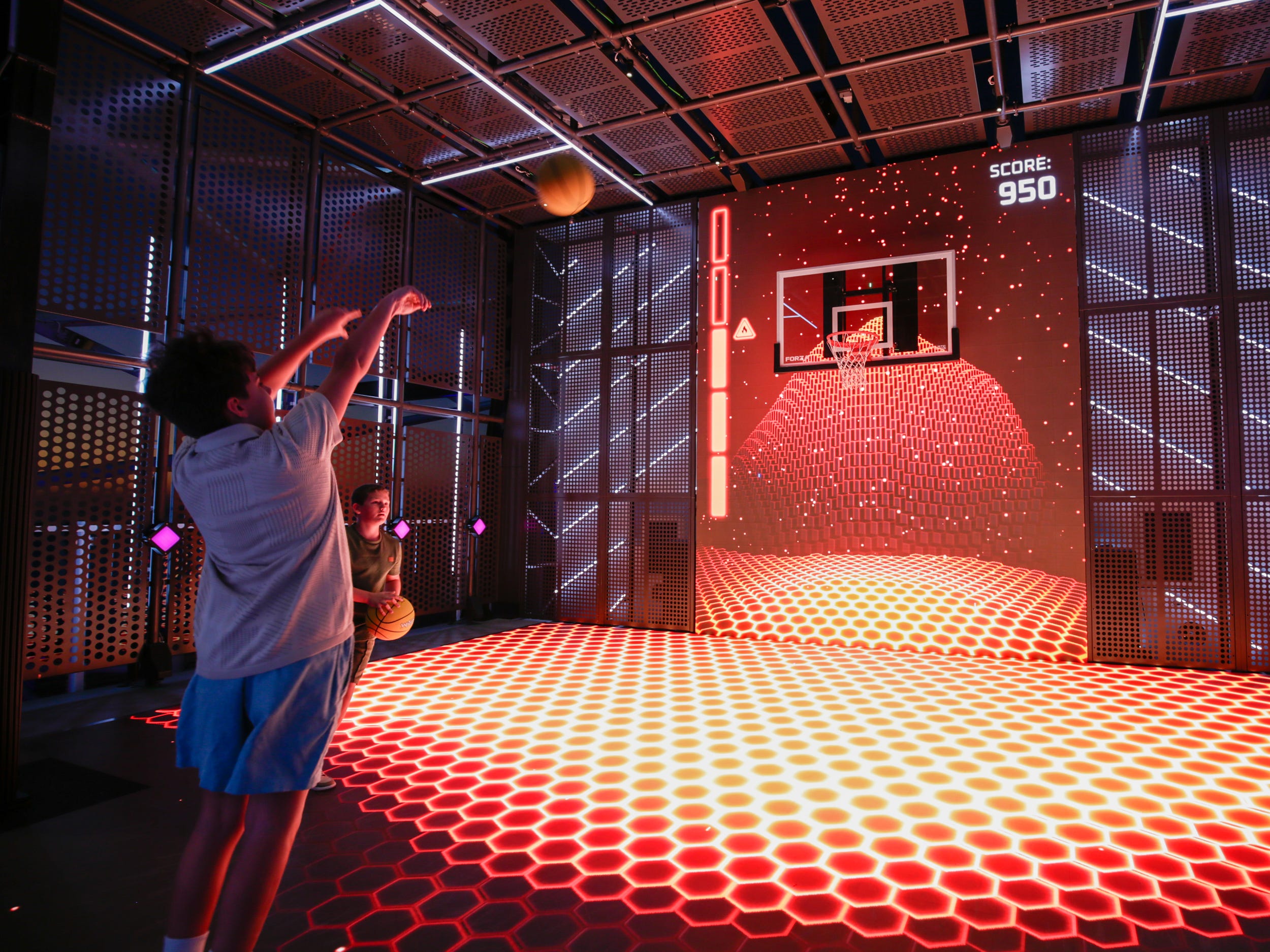 person playing basketball on the glow court on Norwegian Aqua
