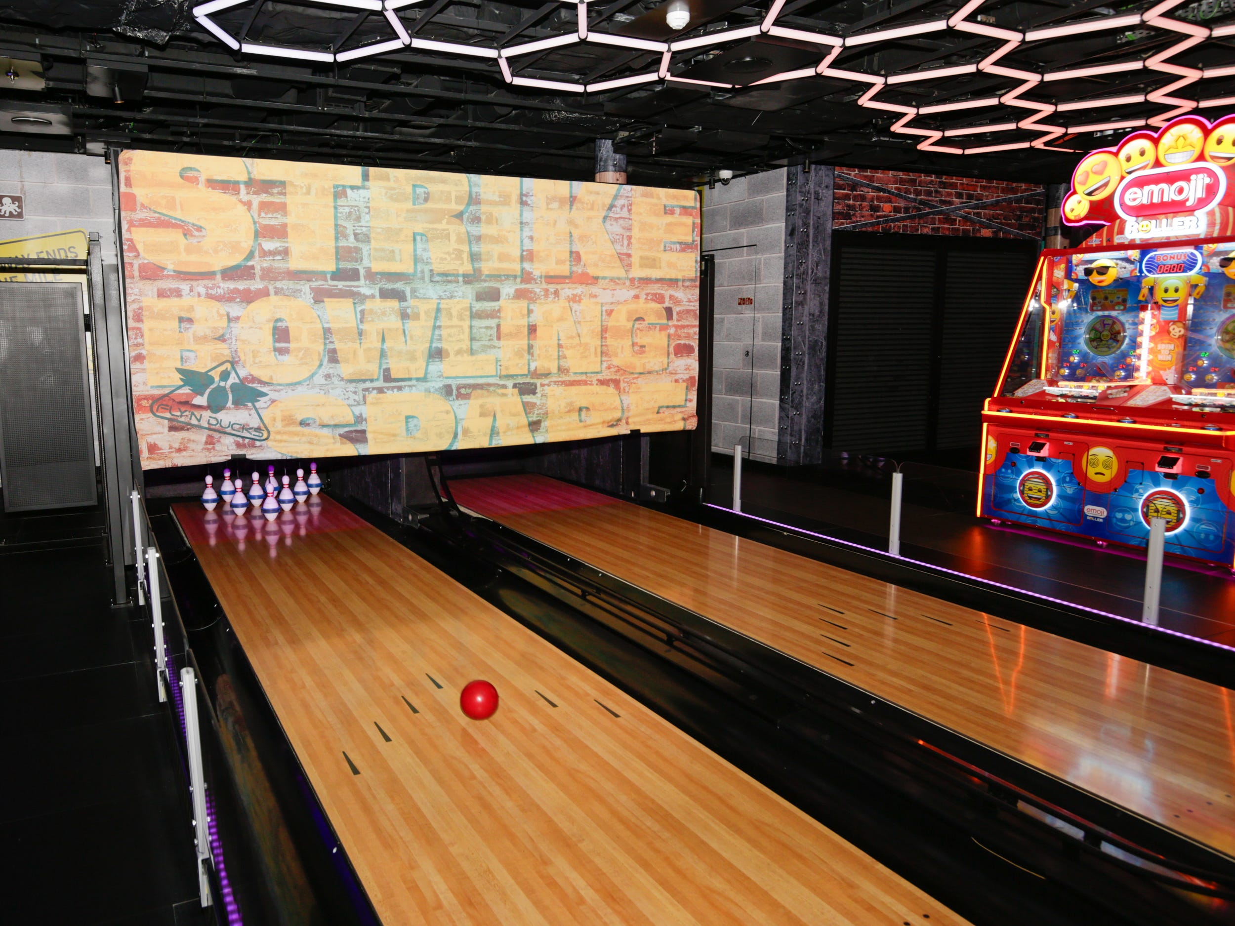 bowling ball going down the alley on Norwegian Aqua at the Aqua Game Zone