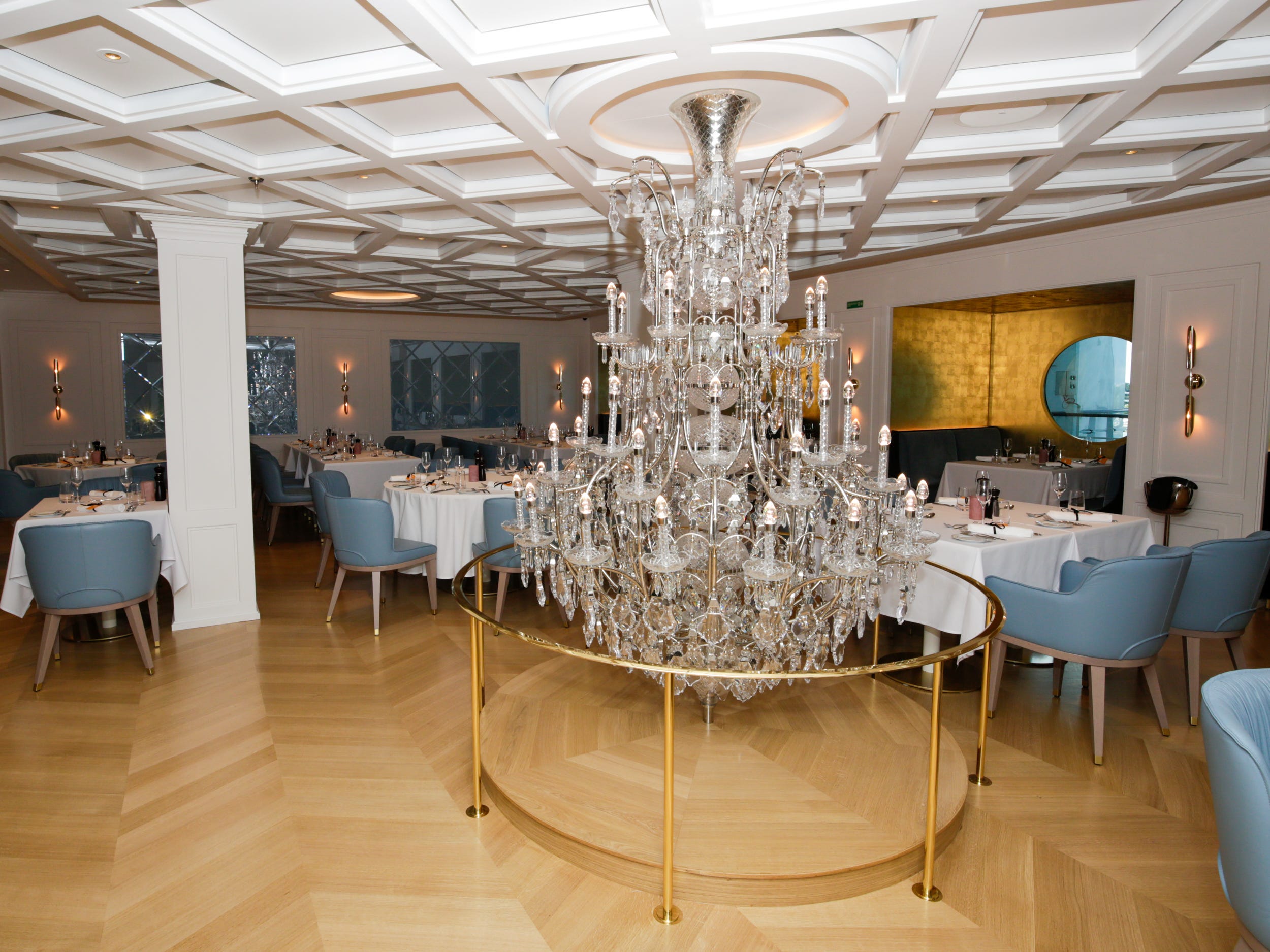 Le Bistro dining room with a chandelier on Norwegian Aqua