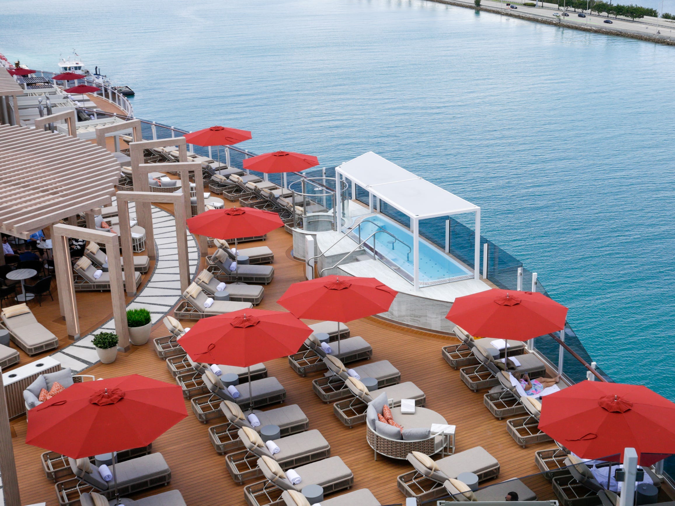 empty lounge chairs at Vibe Beach Club on Norwegian Aqua