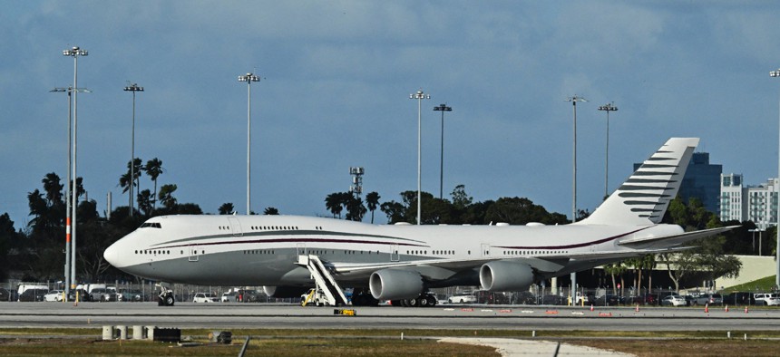 A Qatari Boeing 747 sits on the tarmac of Palm Beach International airport after President Trump toured the aircraft on February 15, 2025.