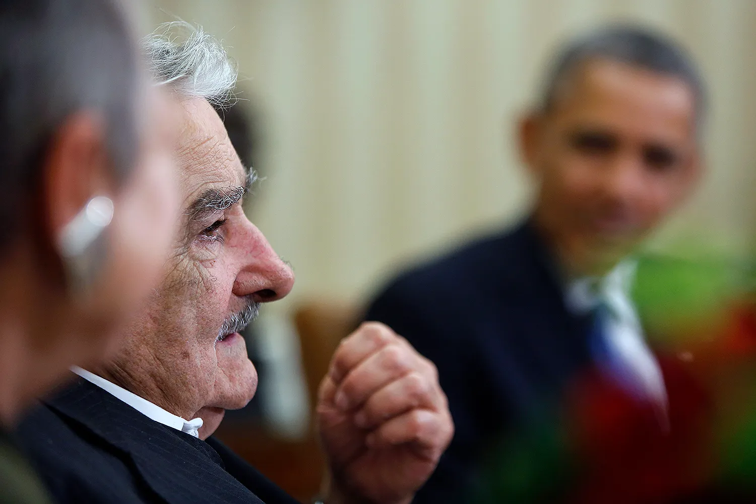 José Mujica sits with Barack Obama.