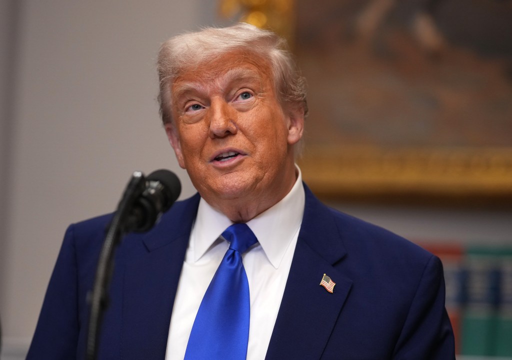 President Donald Trump speaking during a press conference in the Roosevelt Room of the White House, discussing plans to reduce the cost of prescription drugs, dated May 12, 2025.