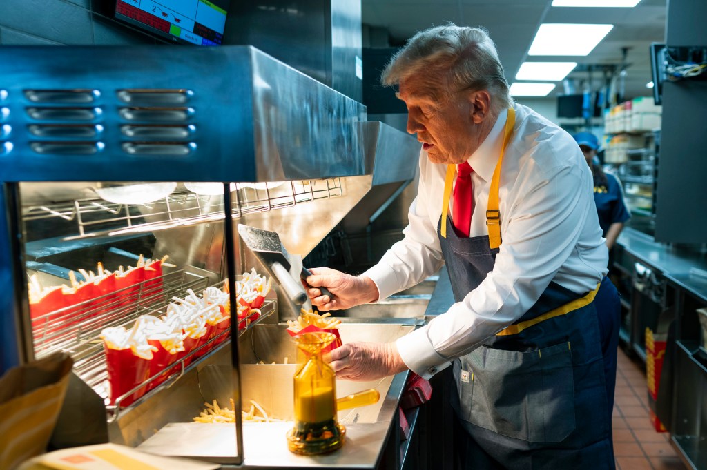 Former President Donald Trump working behind the counter at a McDonald's during a campaign event in Feasterville-Trevose, Pennsylvania on October 20, 2024.