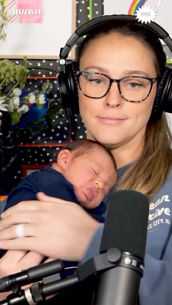 Kylie Kelce on her podcast with her newborn.