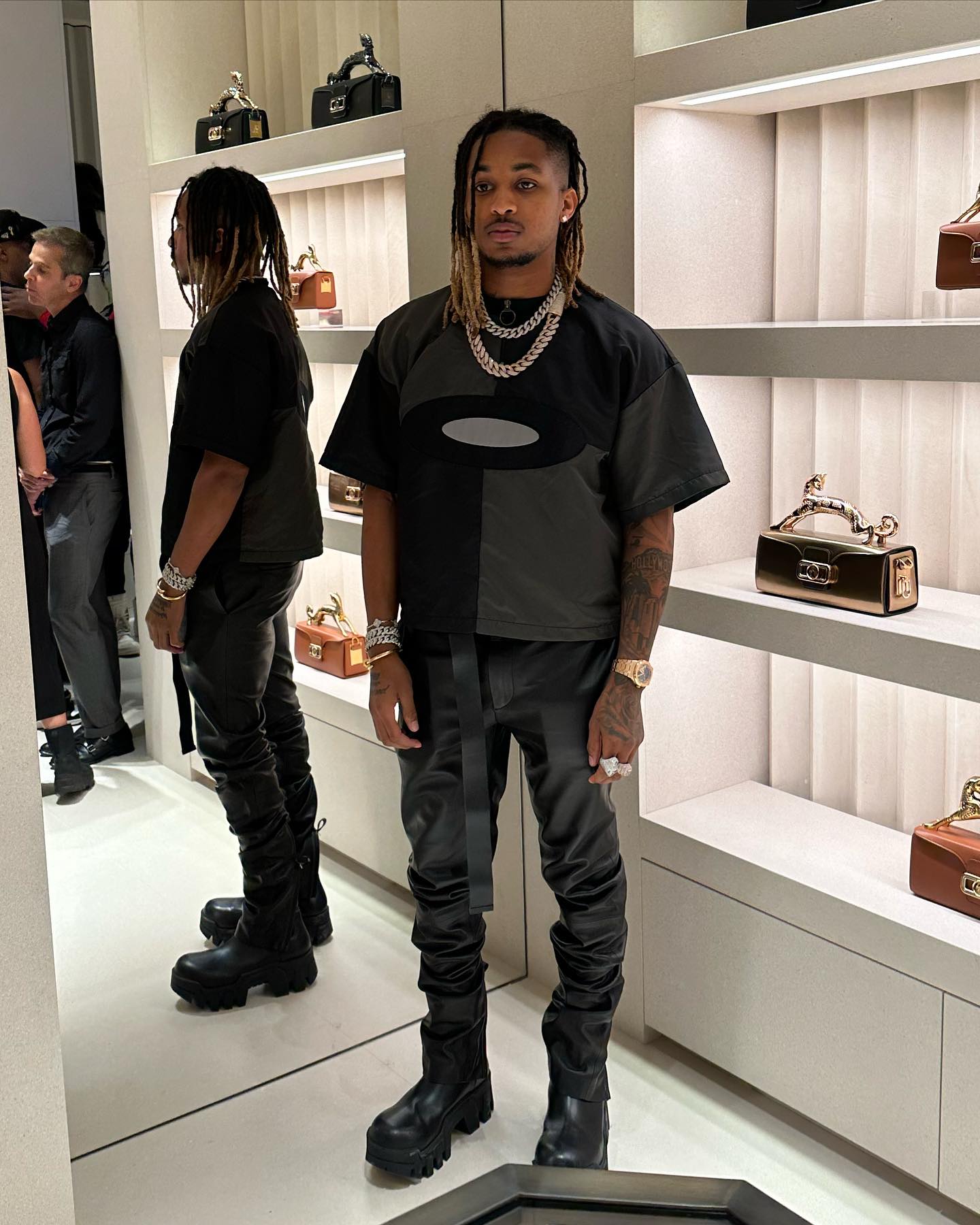 DDG poses in a luxury store. 