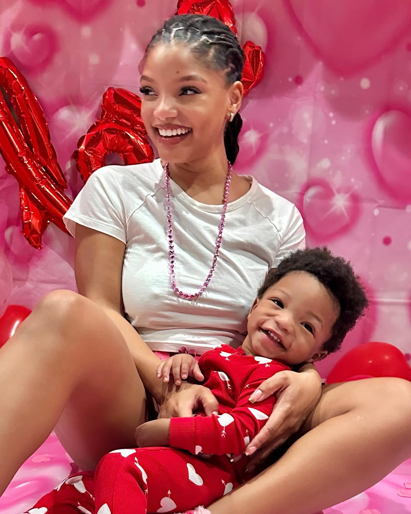 Halle Bailey and son Halo surrounded by hearts. 