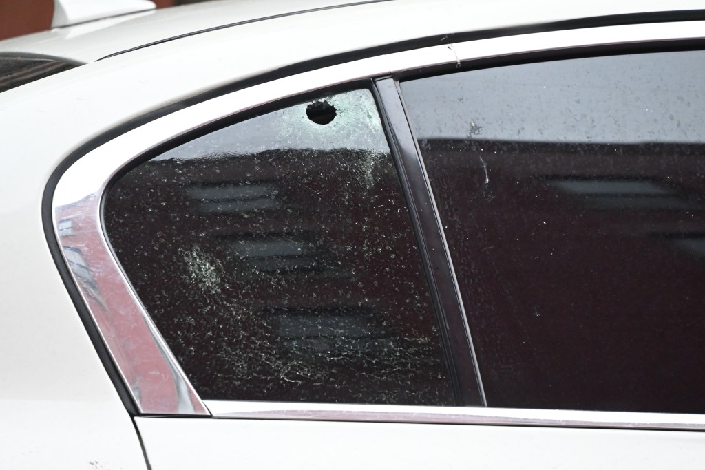 the gunfire instead wounded two people in a passing car — including an 11-year-old boy.