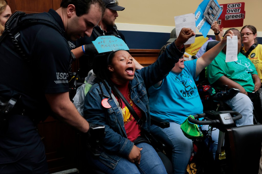 Protesters are removed by Capitol Police Officers during a markup meeting with the House Committee on Energy and Commerce committee on Capitol Hill on May 13, 2025 in Washington, DC.