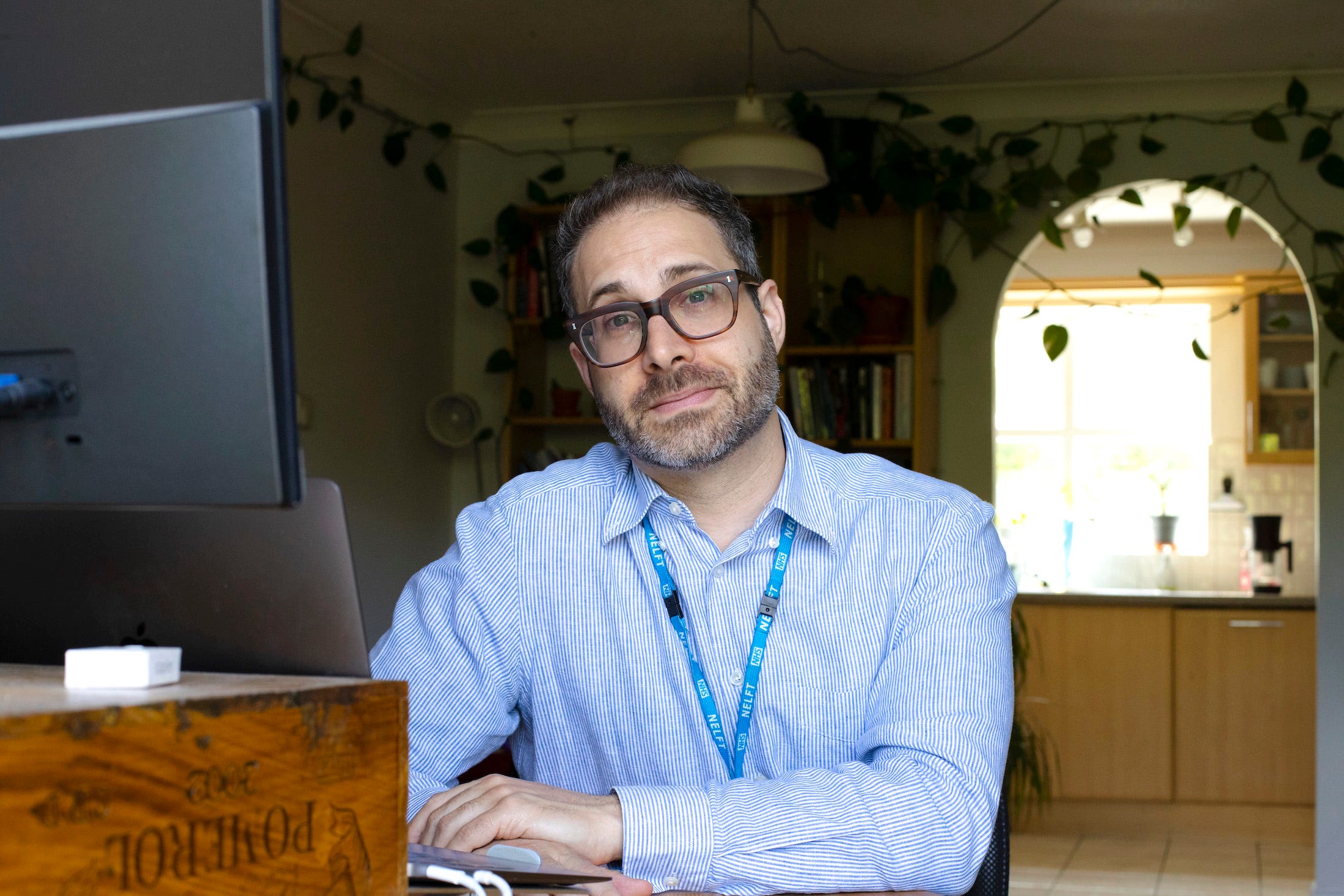 mark sitting at desk