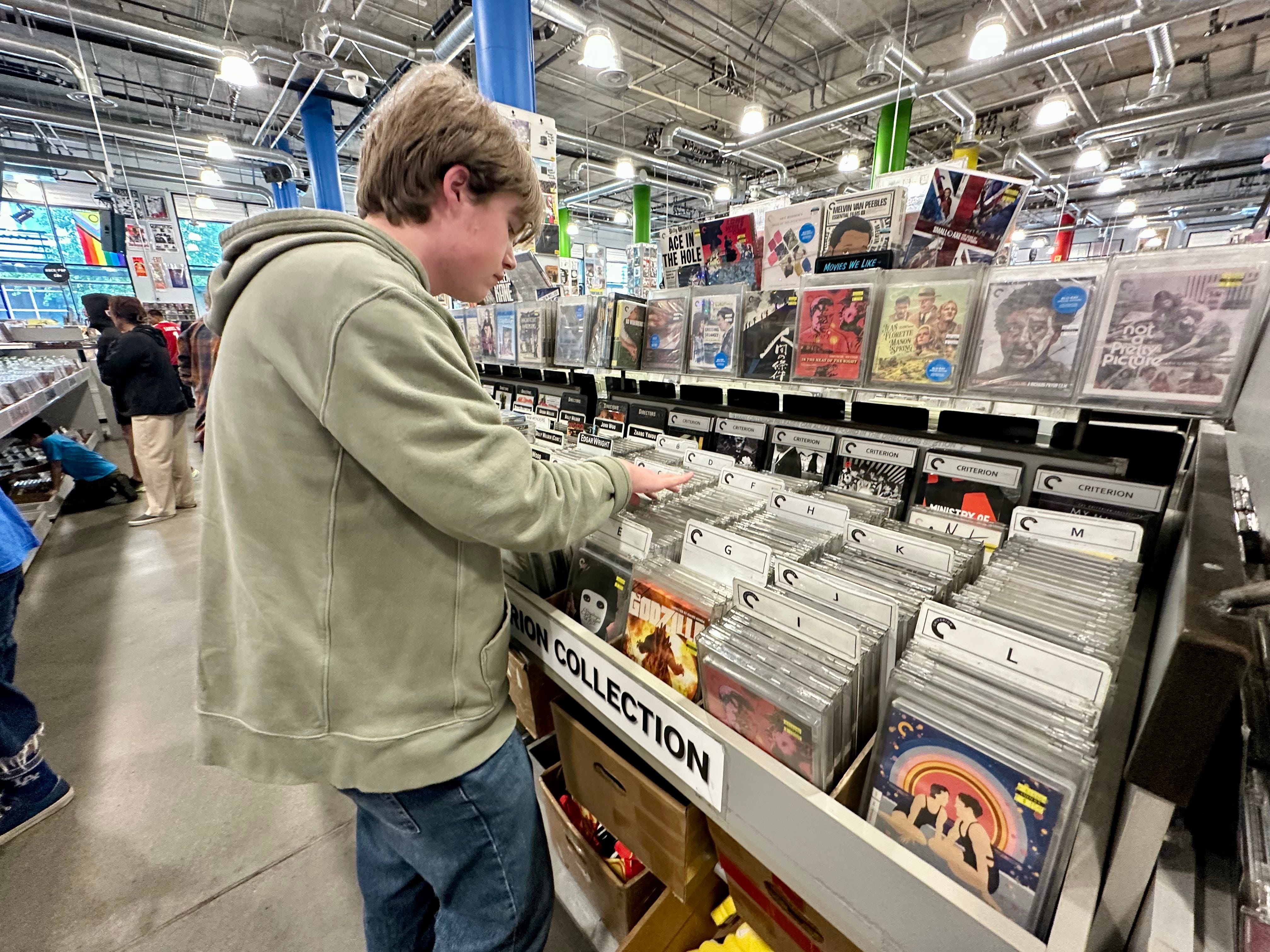 The author's son at a movie store.