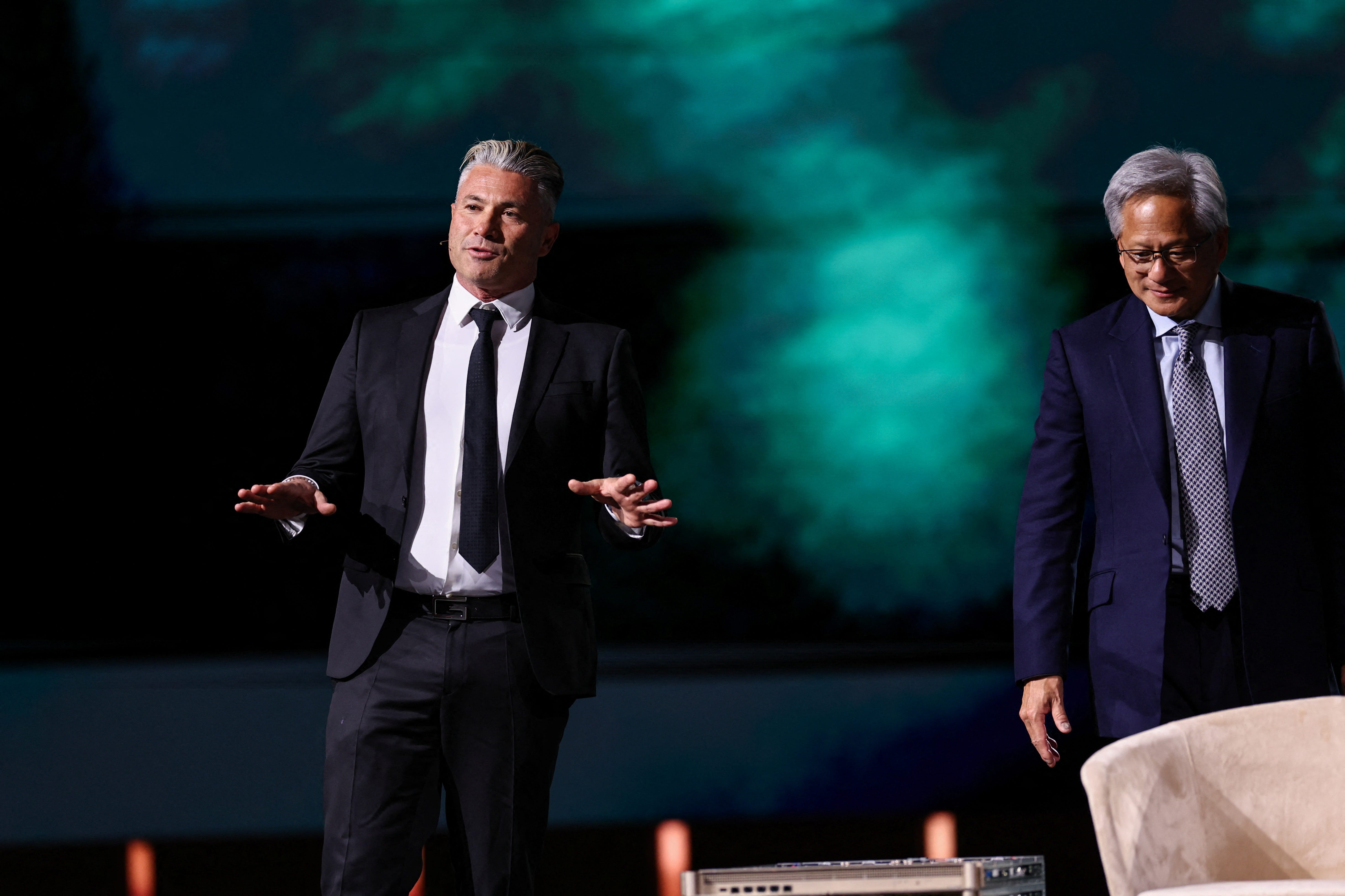 image of Jensen Huang standing with Humain CEO