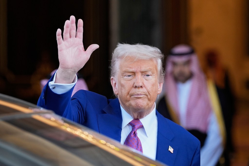 President Donald Trump waves as he leaves the Royal Palace after a signing ceremony with Saudi Crown Prince Mohammed bin Salman in Riyadh, Saudi Arabia, Tuesday, May 13, 2025.