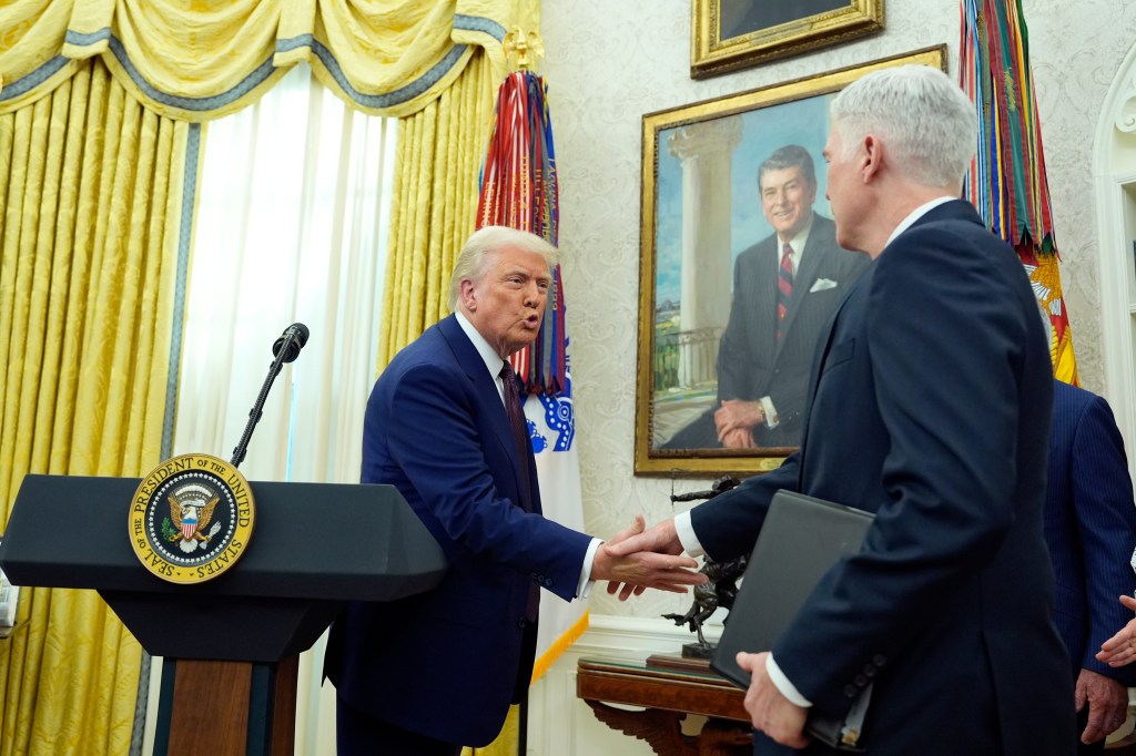 Supreme Court Associate Justice Neil Gorsuch shakes hands with President Donald Trump after swearing in Robert F. Kennedy Jr., as Health and Human Services Secretary in the Oval Office at the White House, Thursday, Feb. 13, 2025, in Washington. 