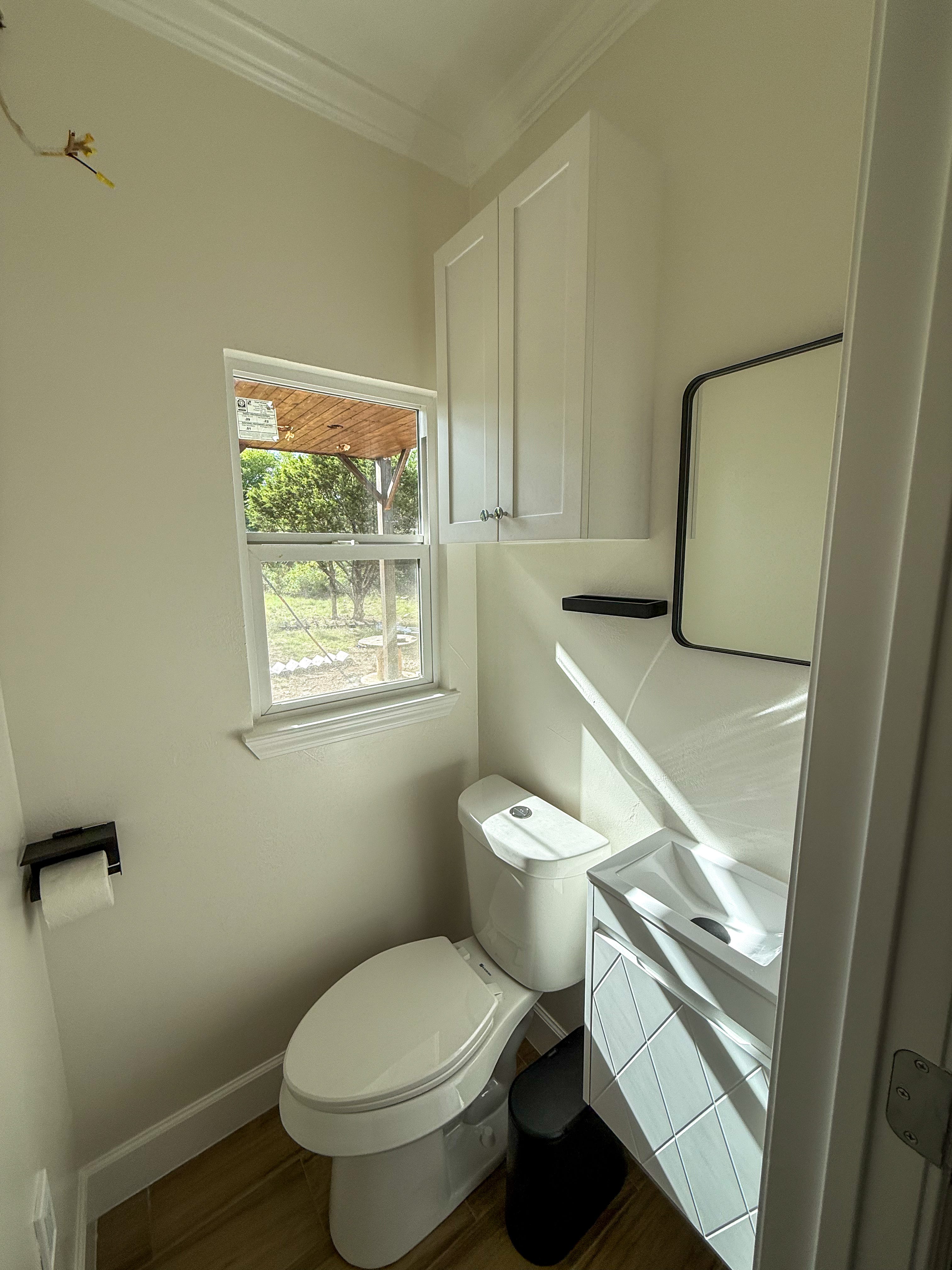 A bathroom with white furnishings.