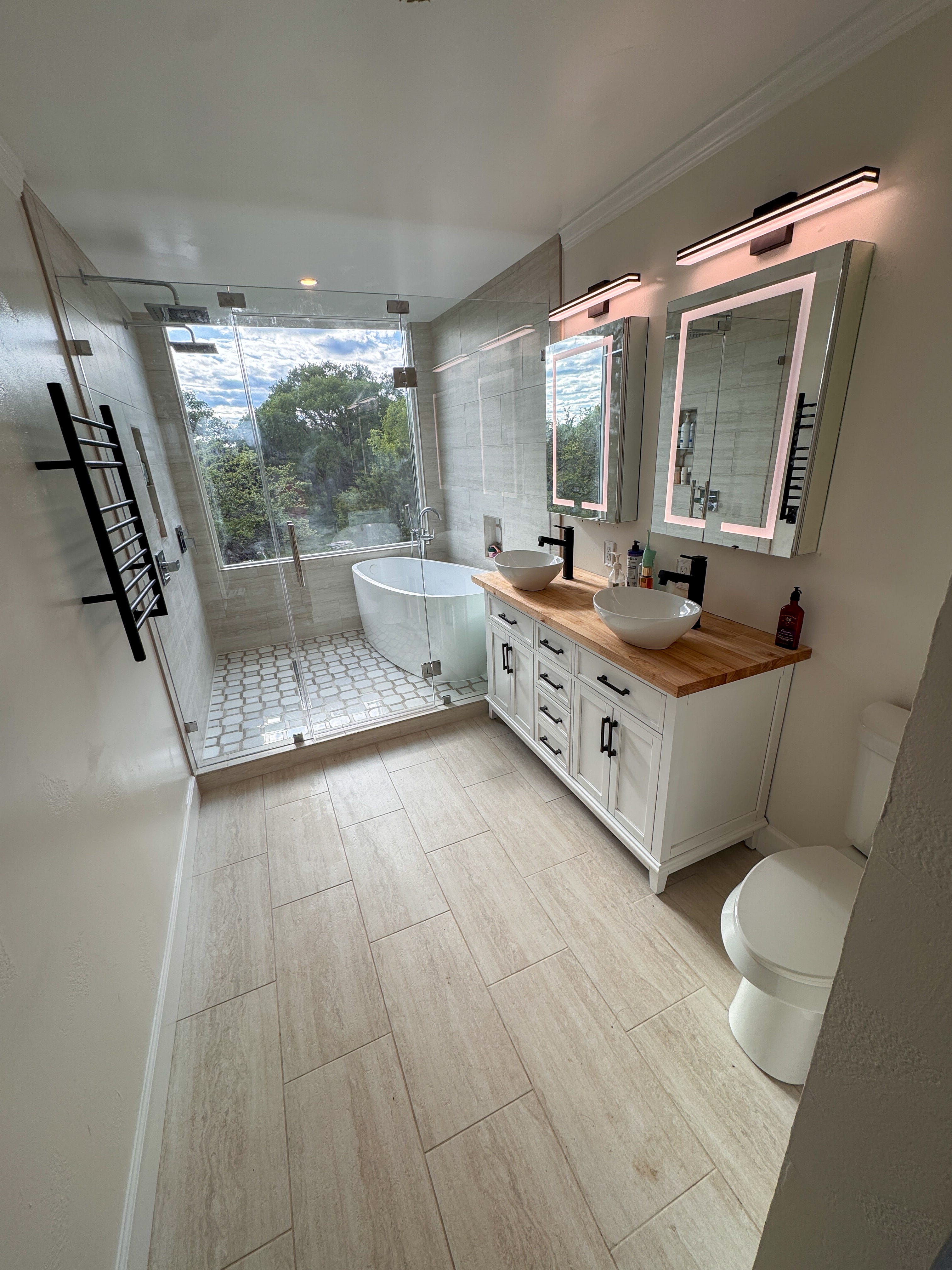 A bathroom with a walk-in shower and bathtub.