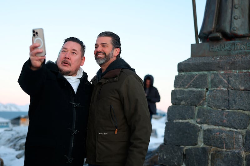 A wellwisher takes a picture with US businessman Donald Trump Jr. after arriving in Nuuk, Greenland on January 7, 2025.