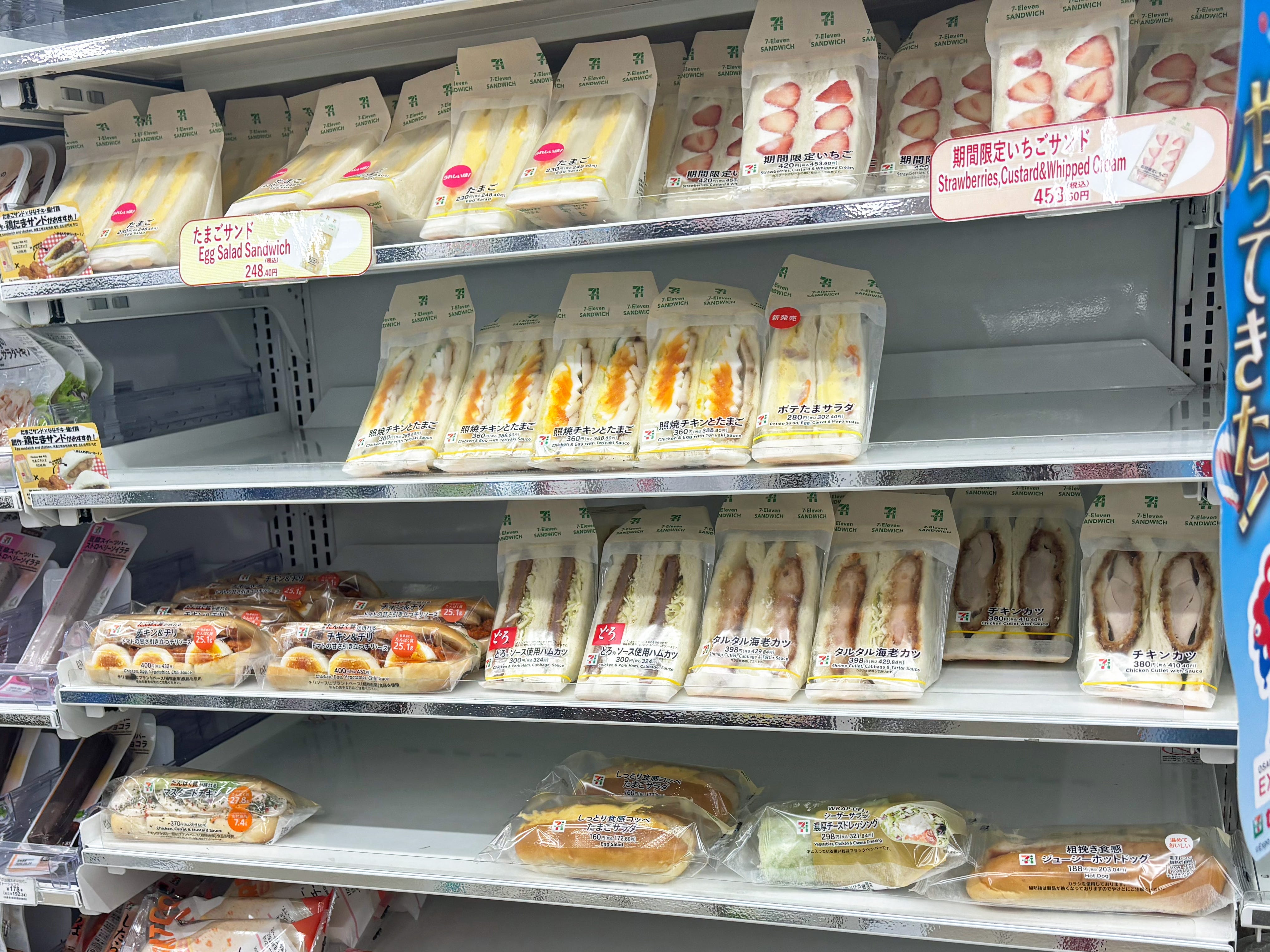 Shelves full of sandwiches and other food in a convenience store