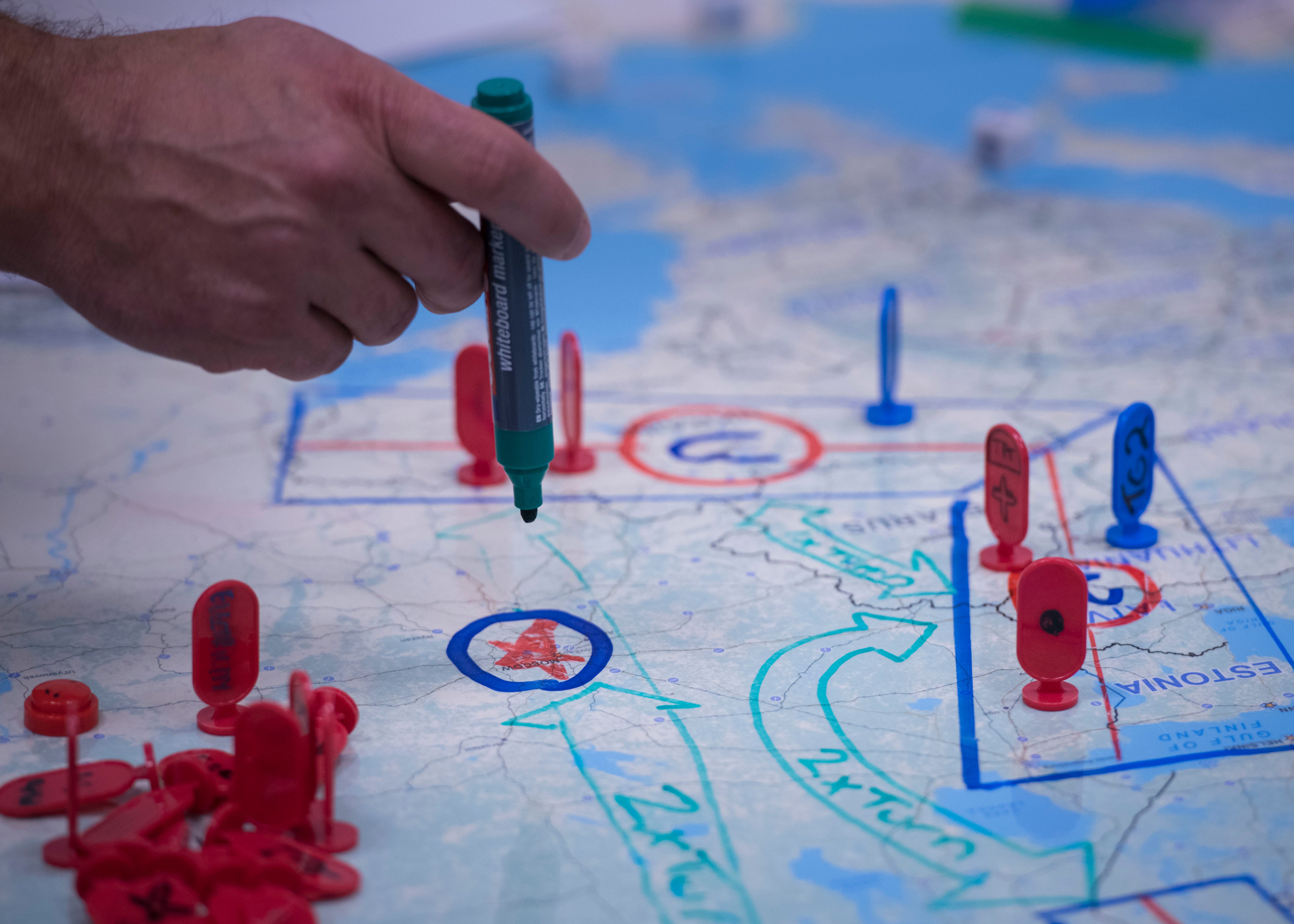 A student describes his strategy during hands-on exercises at the Basic Analytic Wargaming Course taught by the Naval Postgraduate School Wargaming Mobile Education Team in Wiesbaden, Germany, Aug. 30 thru Sept. 10, 2021.