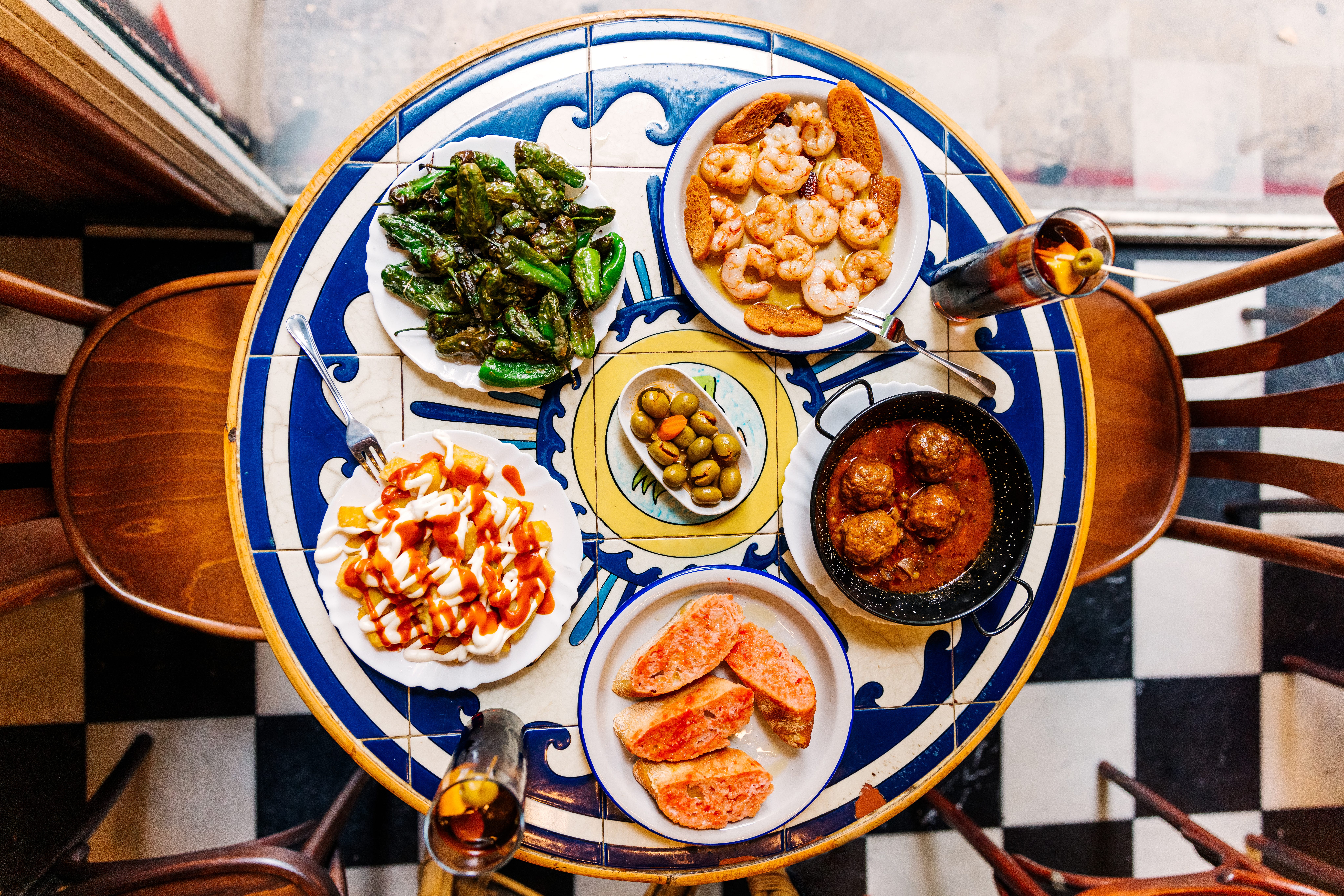 Aerial view of table with shrimp, olives, and other food in Spain
