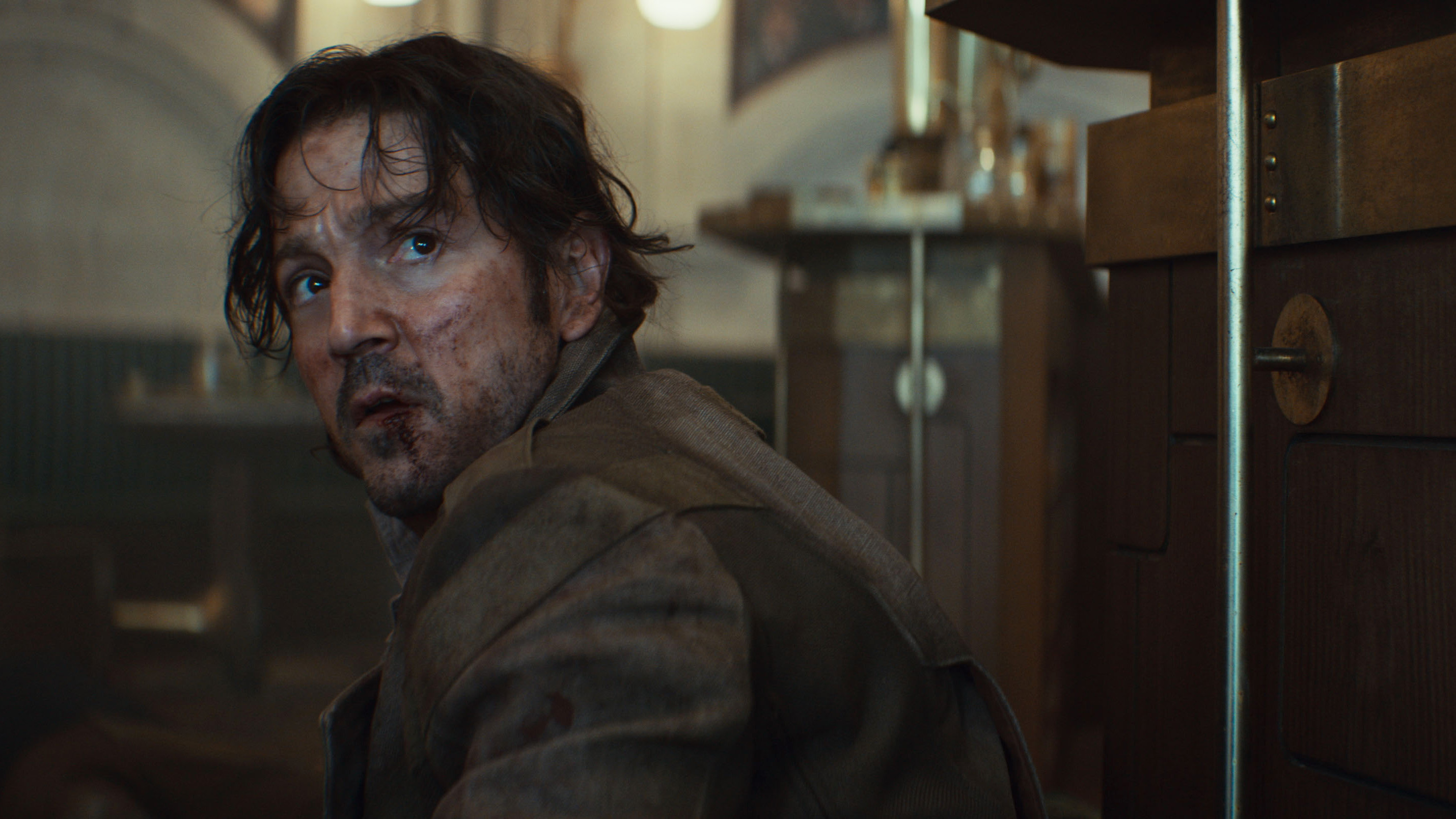 Diego Luna looking bruised and bloodied in Andor