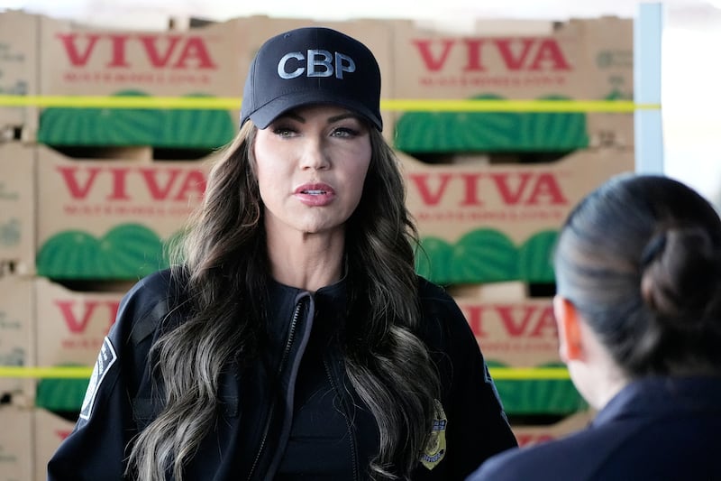 US Secretary of Homeland Security Kristi Noem watches as watermelons are inspected at the Mariposa-Nogales Port of Entry in Nogales, Arizona, March 15, 2025.