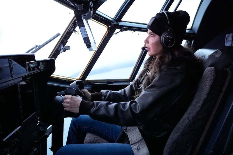 US Secretary of Homeland Security Kristi Noem helps fly an HC-130J during an aerial tour from US Coast Guard Air Station Kodiak on March 17, 2025, in Kodiak Station, Alaska.