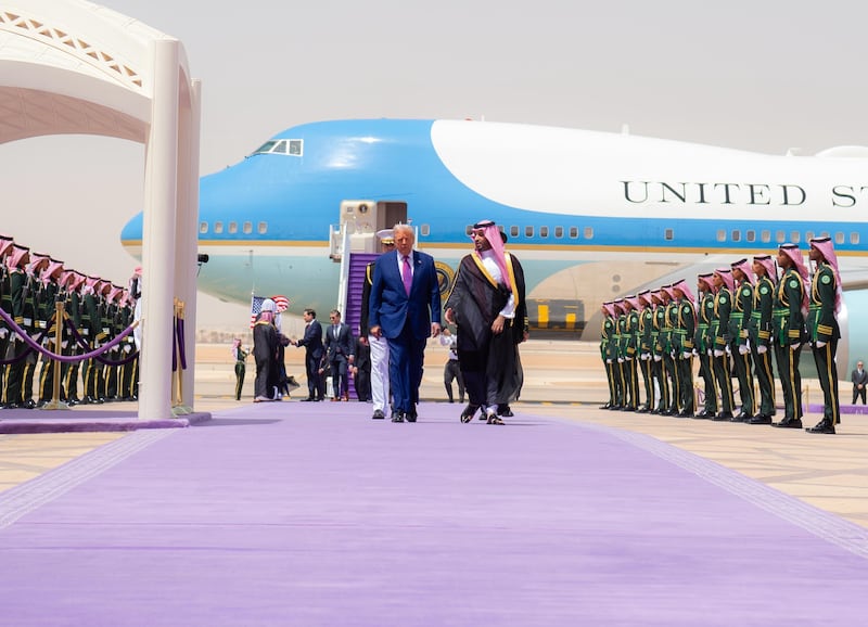 US President Donald Trump (L) is welcomed by Saudi Crown Prince Mohammed bin Salman Al Saud (R) as he arrives at Malik Khalid Airport, for the first leg of his three-country Middle East tour in Riyadh, Saudi Arabia on May 13, 2025.