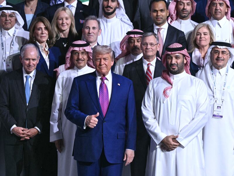 US President Donald Trump (front row-C) and Saudi Crown Prince Mohammed Bin Salman (C-R) pose for a group picture during the Saudi-US investment forum at the King Abdul Aziz International Conference Center in Riyadh on May 13, 2025. Saudi Arabia on May 13 promised billions of dollars in deals with the United States from defence to artificial intelligence as it threw a lavish welcome for President Donald Trump on the first state visit of his second term. (Photo by Brendan SMIALOWSKI / AFP) (Photo by BRENDAN SMIALOWSKI/AFP via Getty Images)
