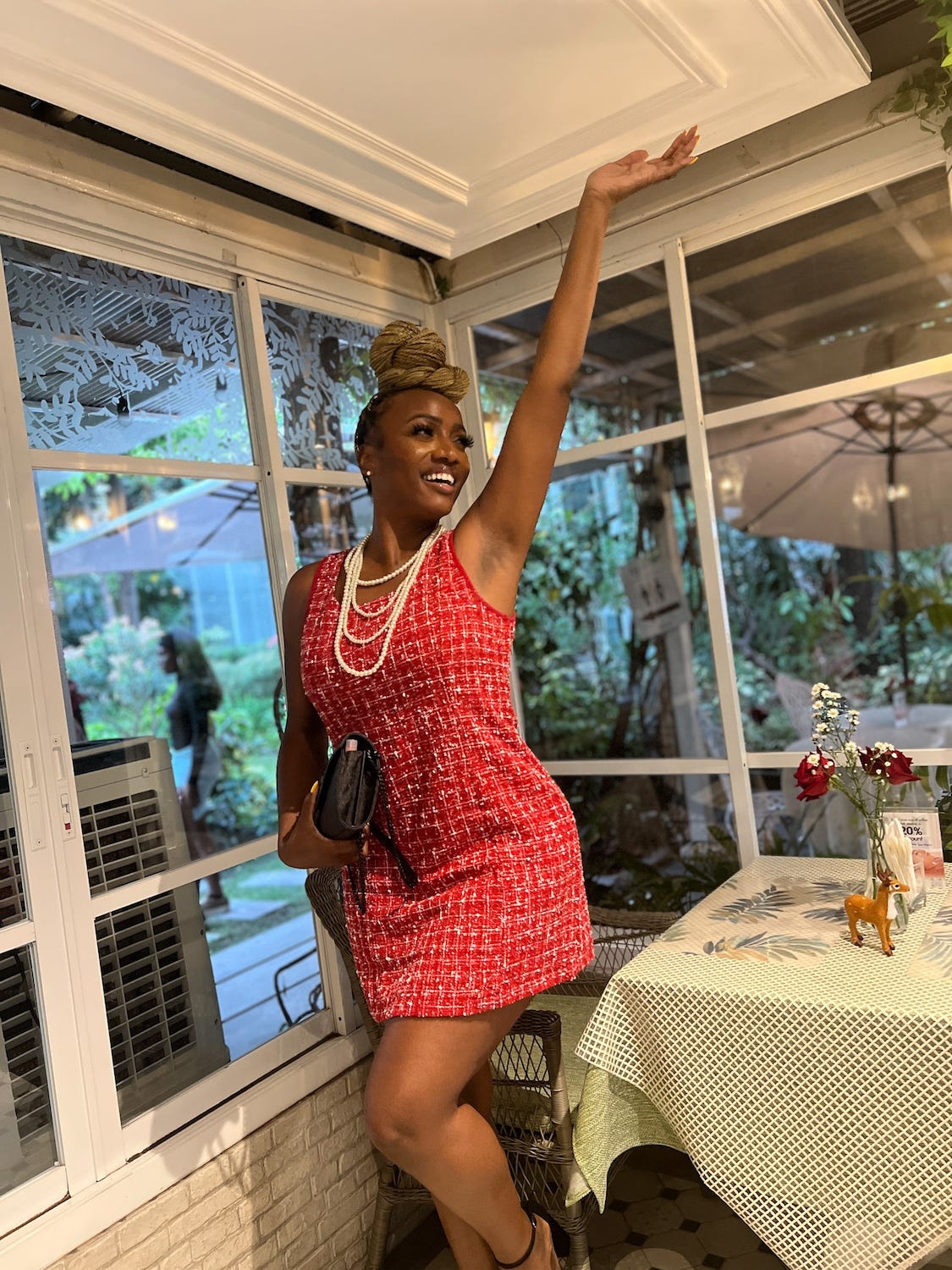 A woman posing in a restaurant in Bangkok.