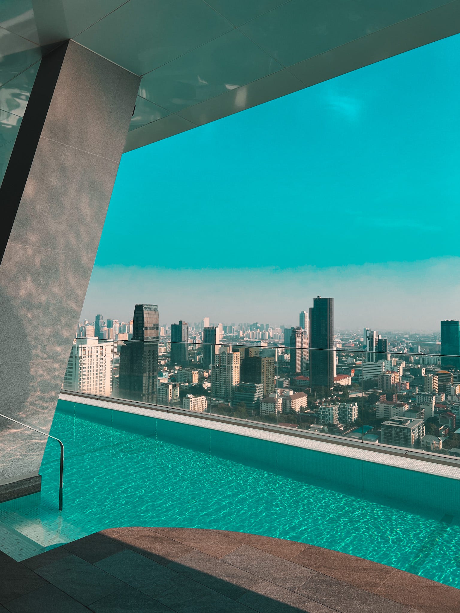The apartment building has stunning views of the Bangkok skyline.