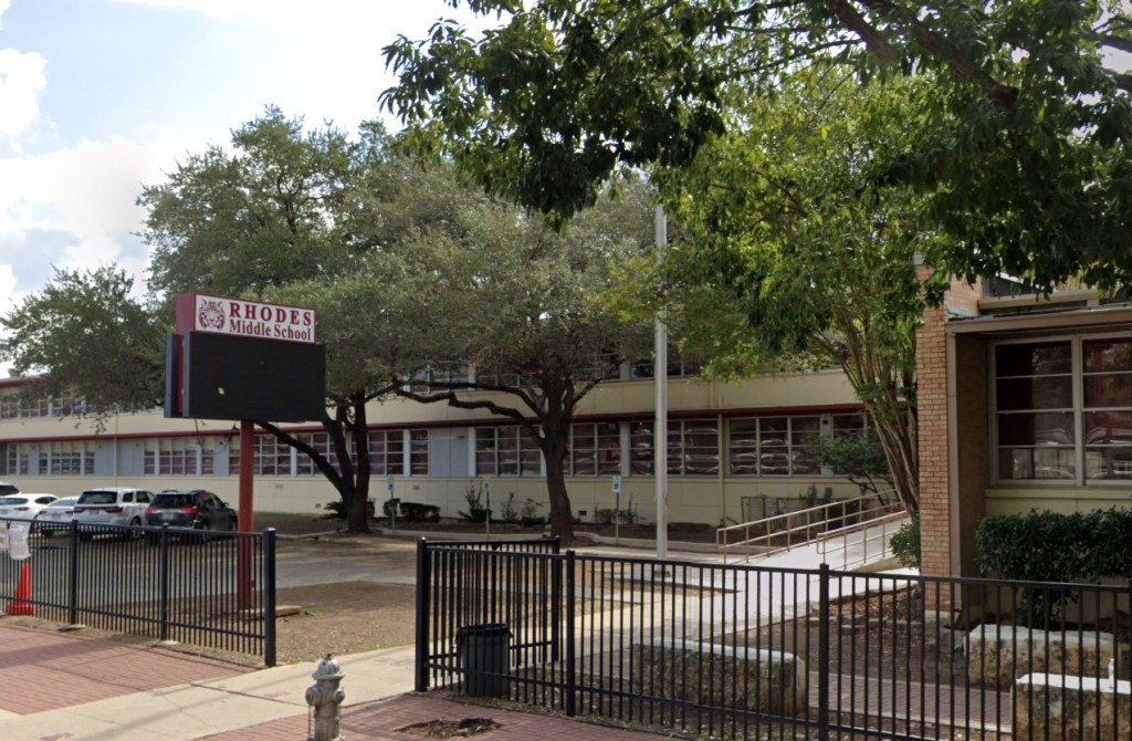 Cops arrested Ashley Pardo, 33 — who sports purple hair and multiple face tattoos in her mug shot — Monday and charged her with aiding in commission of terrorism for helping the boy plan to conduct “mass targeted violence” on the Rhodes Middle School in San Antonio, according to an affidavit obtained by ABC News.