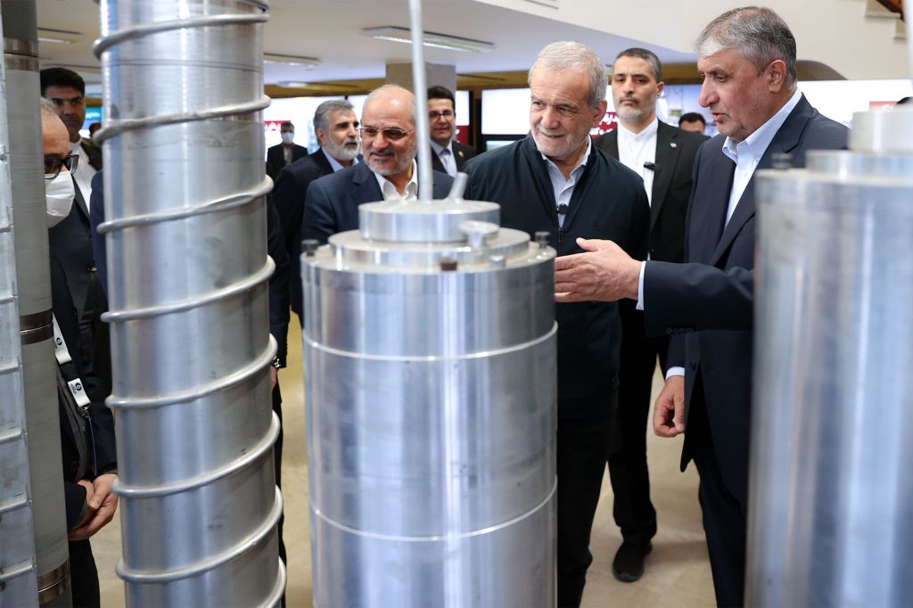 Iranian president Masoud Pezeshkian (2R) and head of Iranian Atomic Organization Mohammad Eslami (R) as they visit a nuclear achievement exhibition during a ceremony marking Iran's Atomic Technology Day in Tehran, Iran, 09 April 2025.