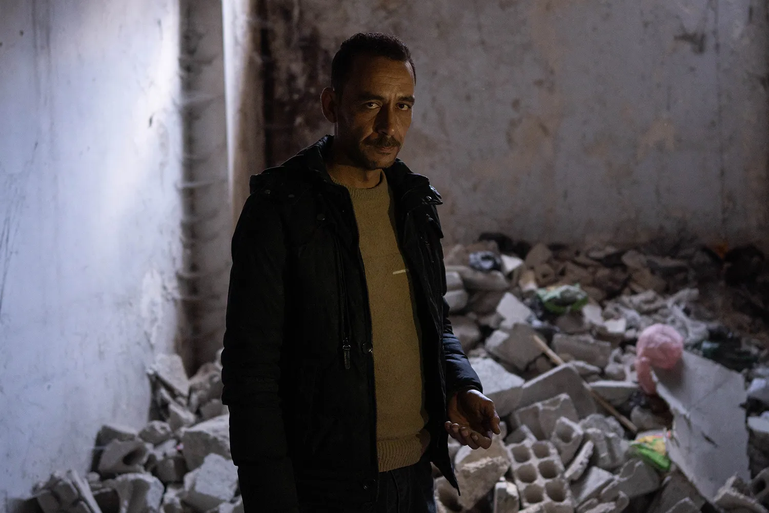 Abu Ahmed stands in an underground clinic in Ghouta.