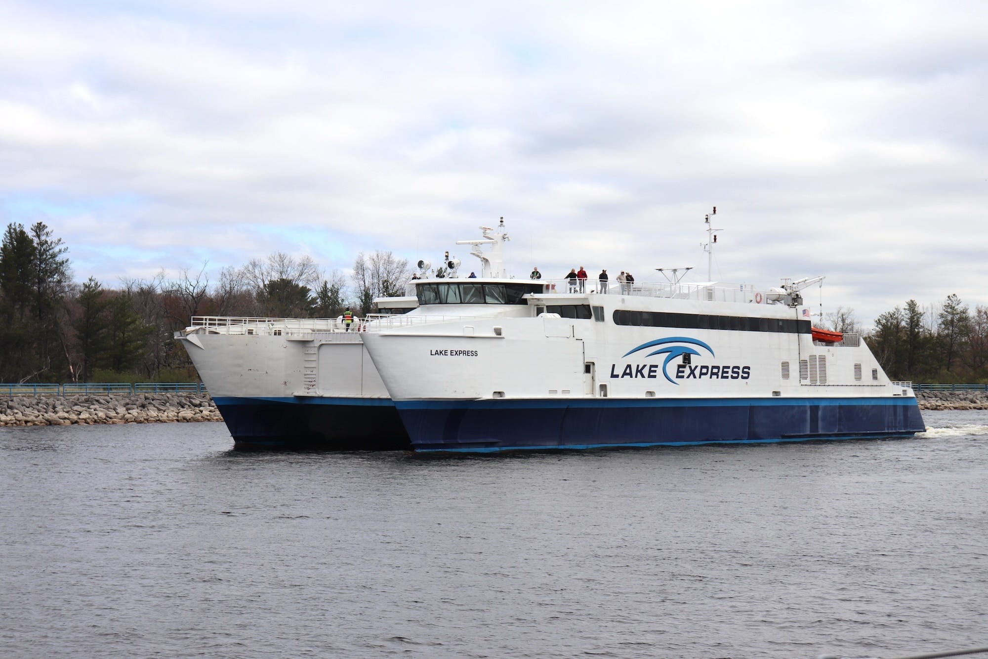 The Lake Express ferry passes by the USS Silversides on the Muskegon Lake Channel.
