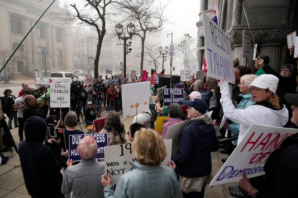 Protesters seen outside the courthouse.