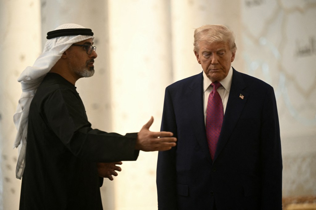 President Trump listens to Abu Dhabi's Crown Prince Sheikh Khaled bin Mohamed bin Zayed Al Nahyan, as he visits the Sheikh Zayed Grand Mosque in Abu Dhabi.