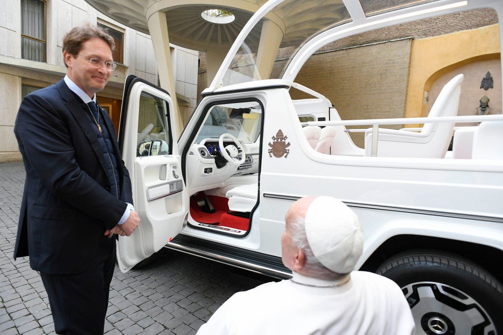 Mercedes CEO Ola Källenius presents a new popemobile to Pope Francis.