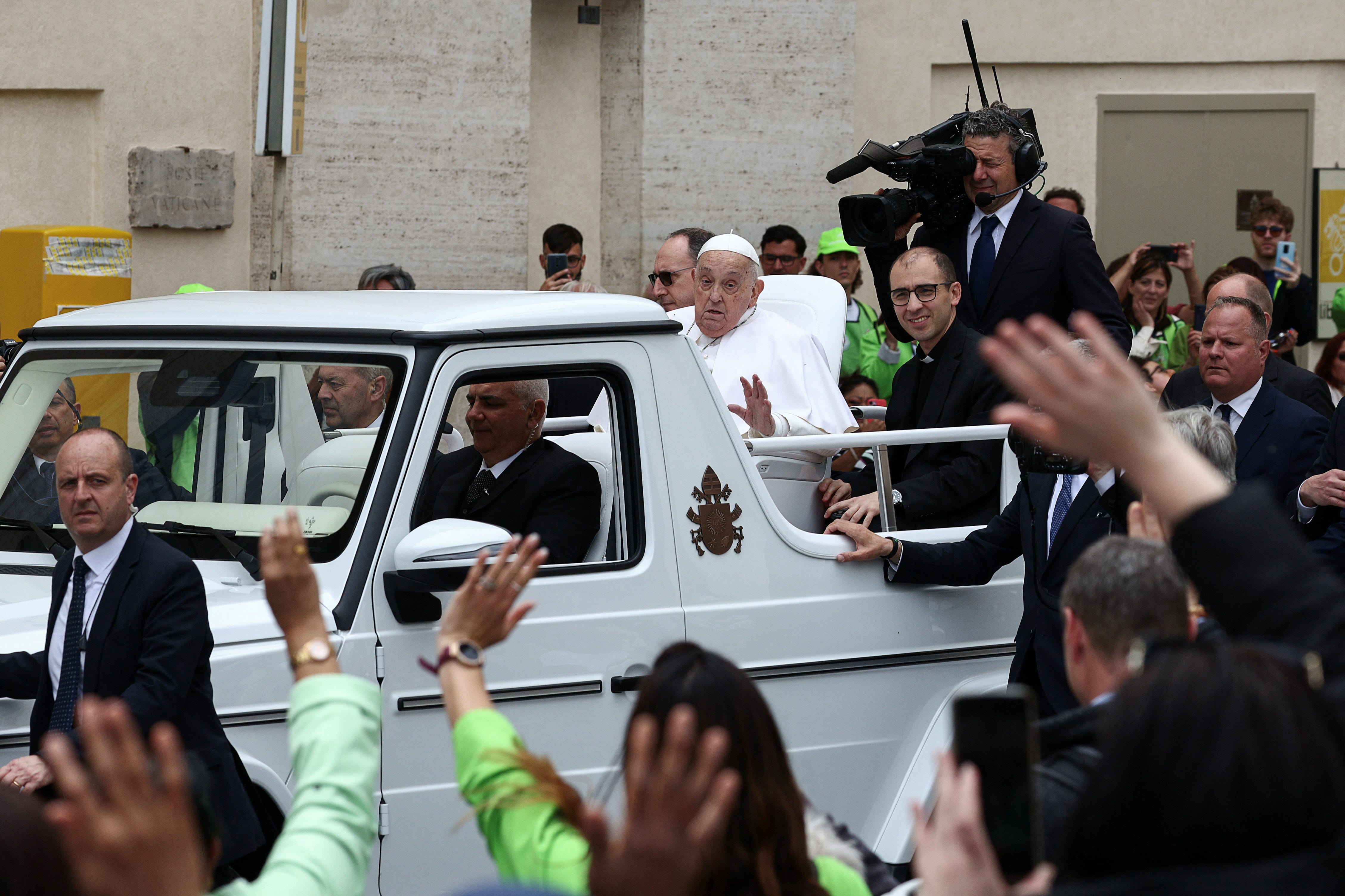 Pope Francis rides the Popemobile one day before his death.