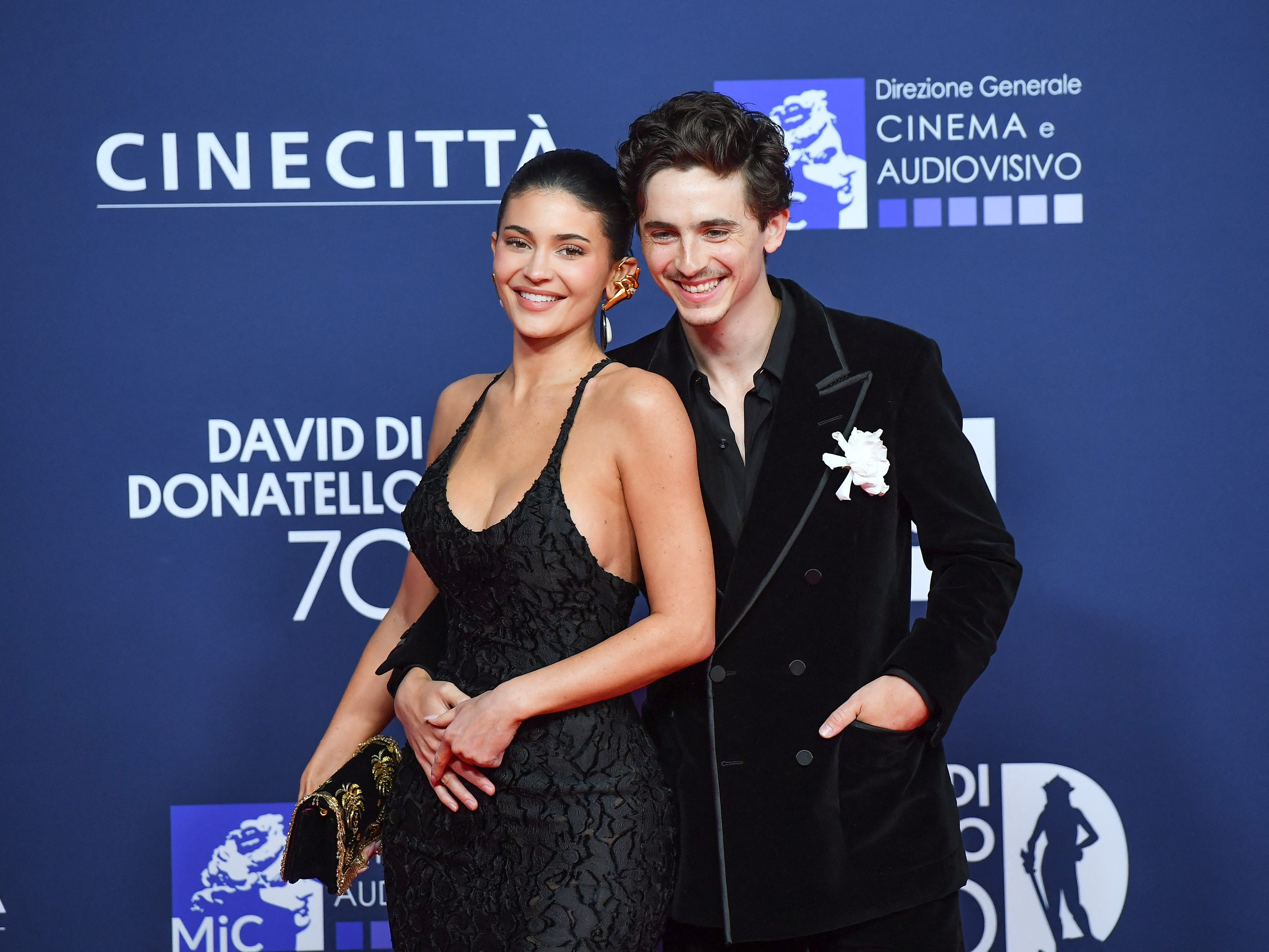 Kylie Jenner and Timothée Chalamet pose on the red carpet at an awards ceremony in Rome.