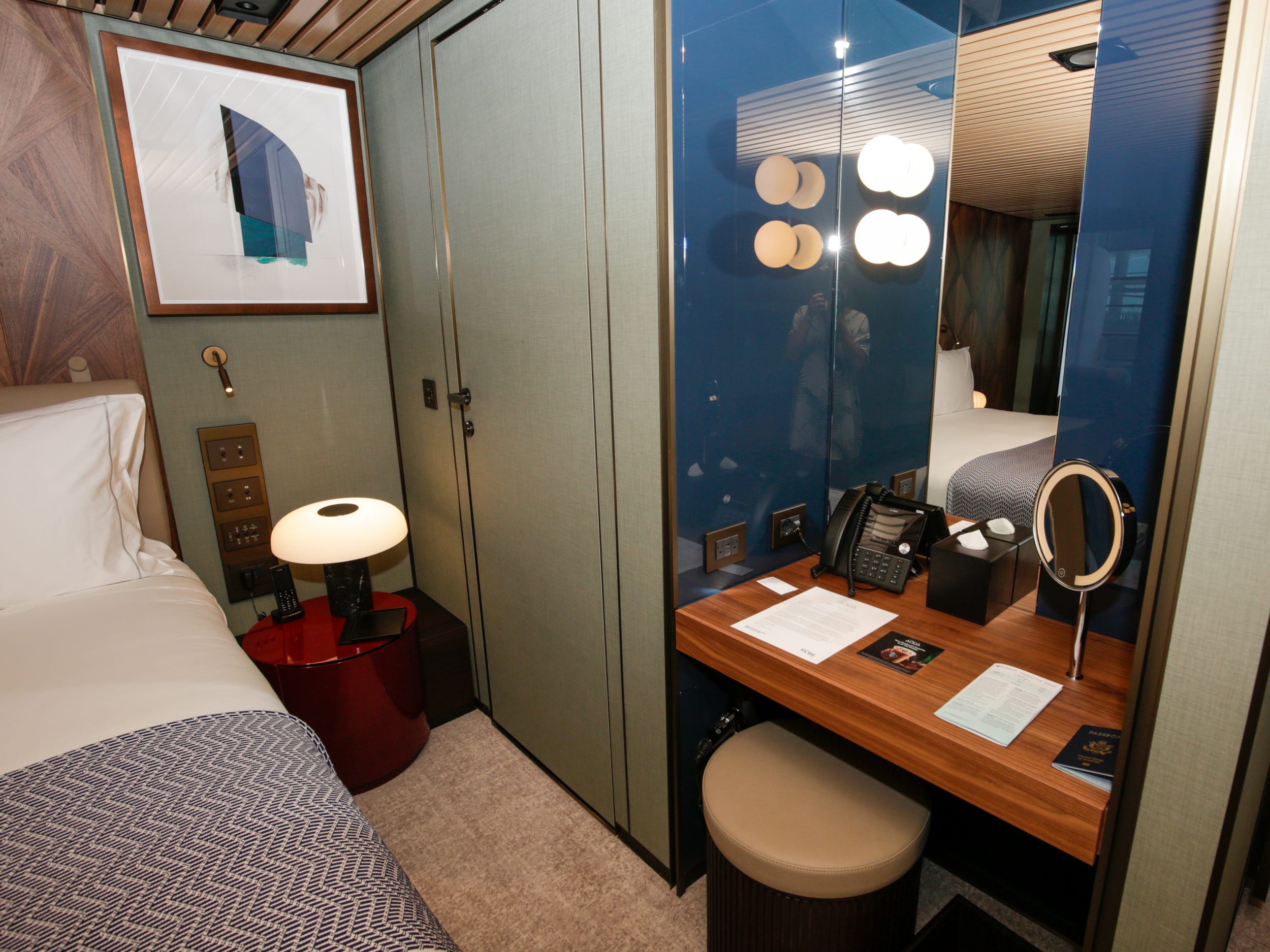 empty desk next to bed in the Haven Penthouse with Balcony on Norwegian Aqua