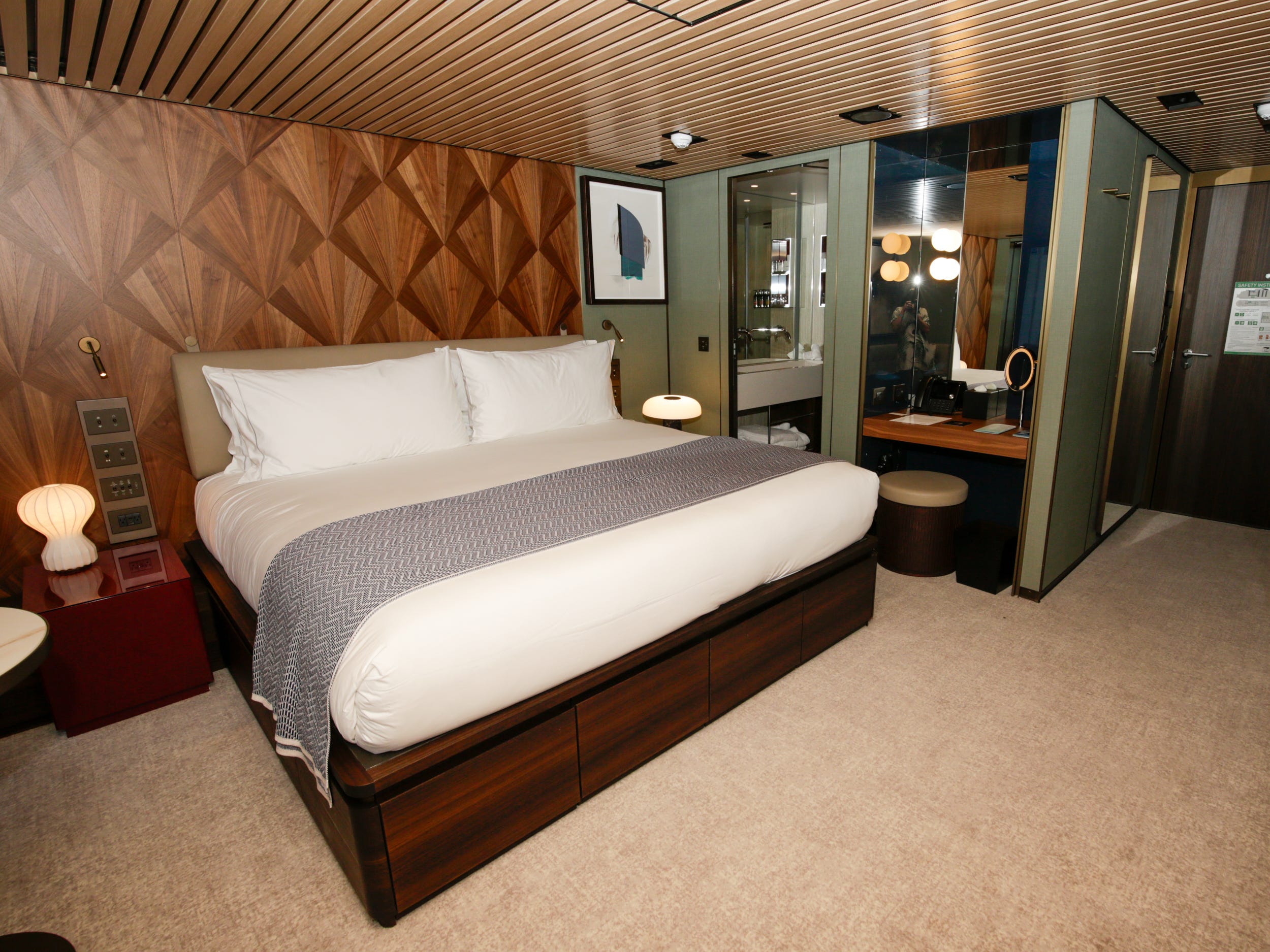empty bed in the Haven Penthouse with Balcony on Norwegian Aqua