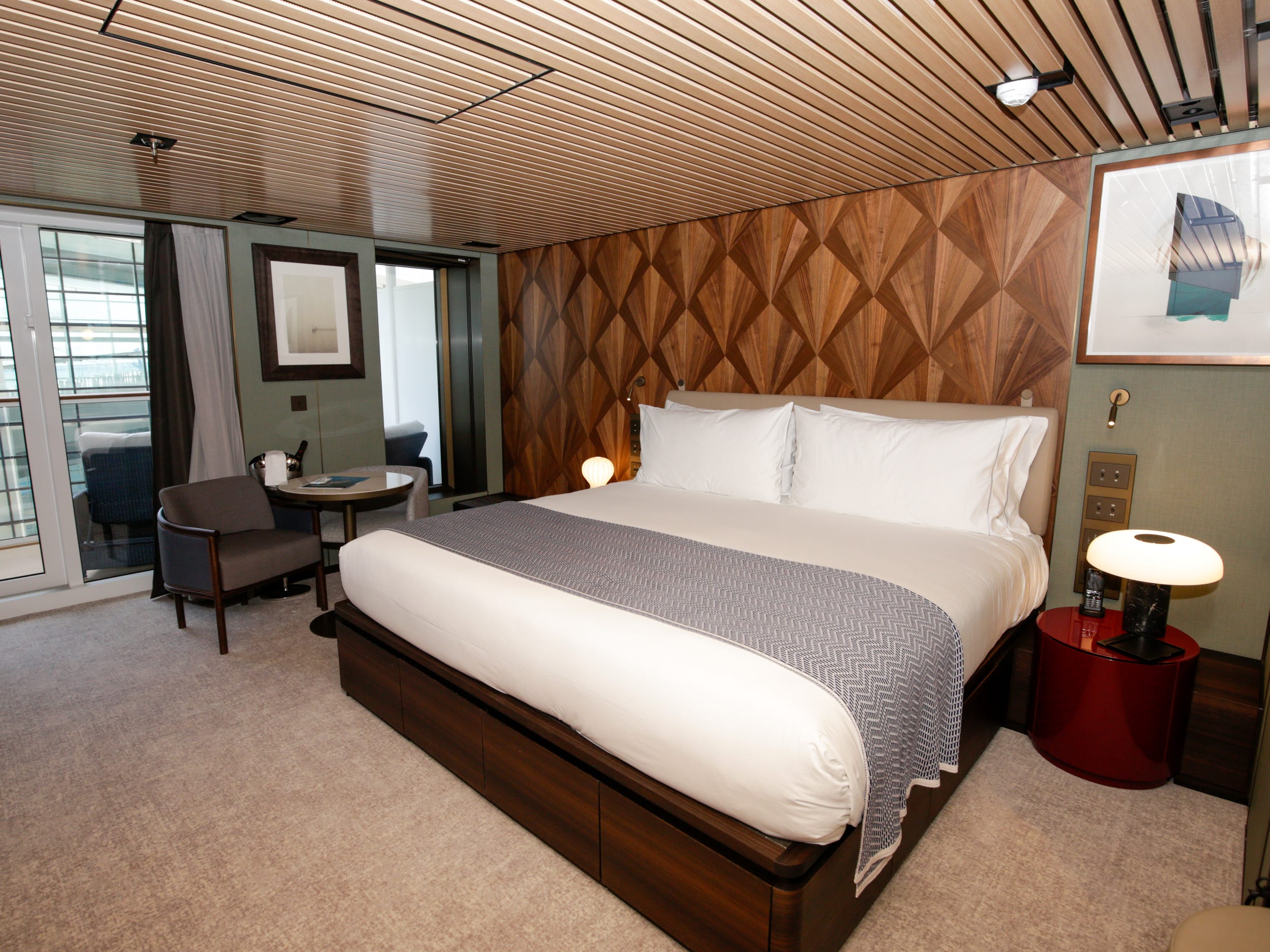 empty bed in the Haven Penthouse with Balcony on Norwegian Aqua