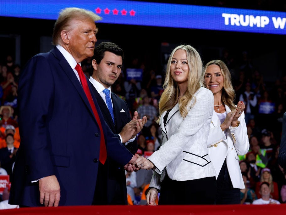 Tiffany Trump shakes Donald Trump's hand as Michael Boulos looks on.