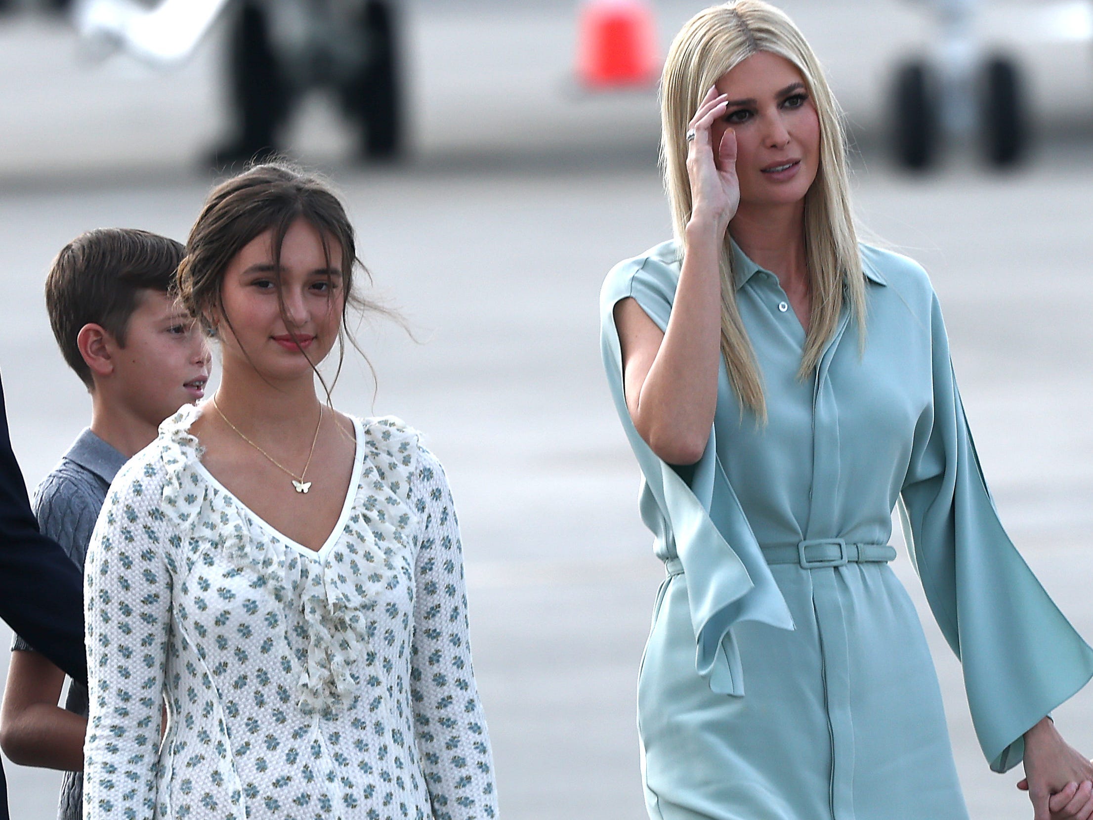 Jared Kushner (L), son Joseph Kushner, daughter Arabella Kushner, Ivanka Trump, and son Theodore Kushner (R) prepare to board a U.S. Air Force aircraft bound for Washington DC on January 18, 2025 in West Palm Beach, Florida