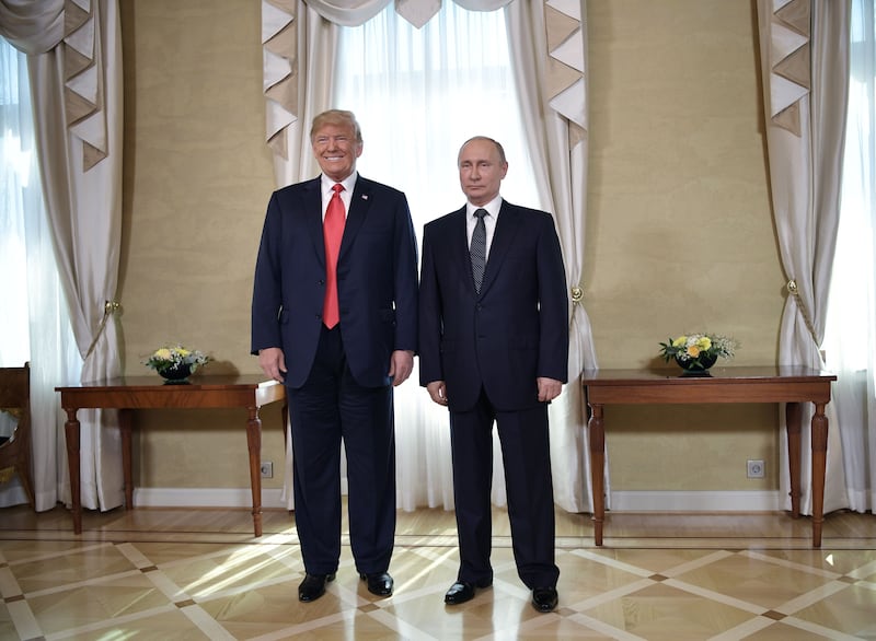 U.S. President Donald Trump and Russian President Vladimir Putin pose together ahead a meeting in Helsinki on July 16, 2018.