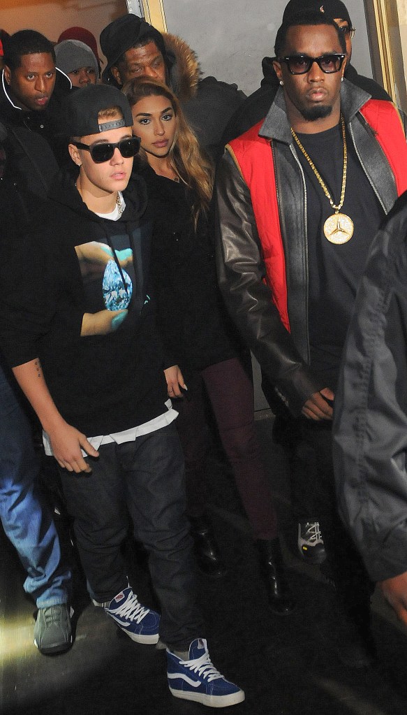 Justin Bieber, Chantel Jeffries and Sean 'Diddy' Combs attend Ciroc party at Vanquish Lounge on February 5, 2014 in Atlanta, Georgia. 