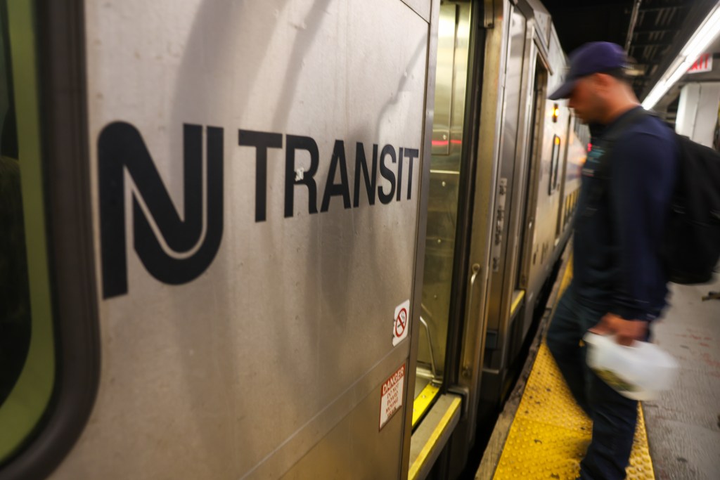 People board a New Jersey Transit train in Manhattan on May 15, 2025 in New York City