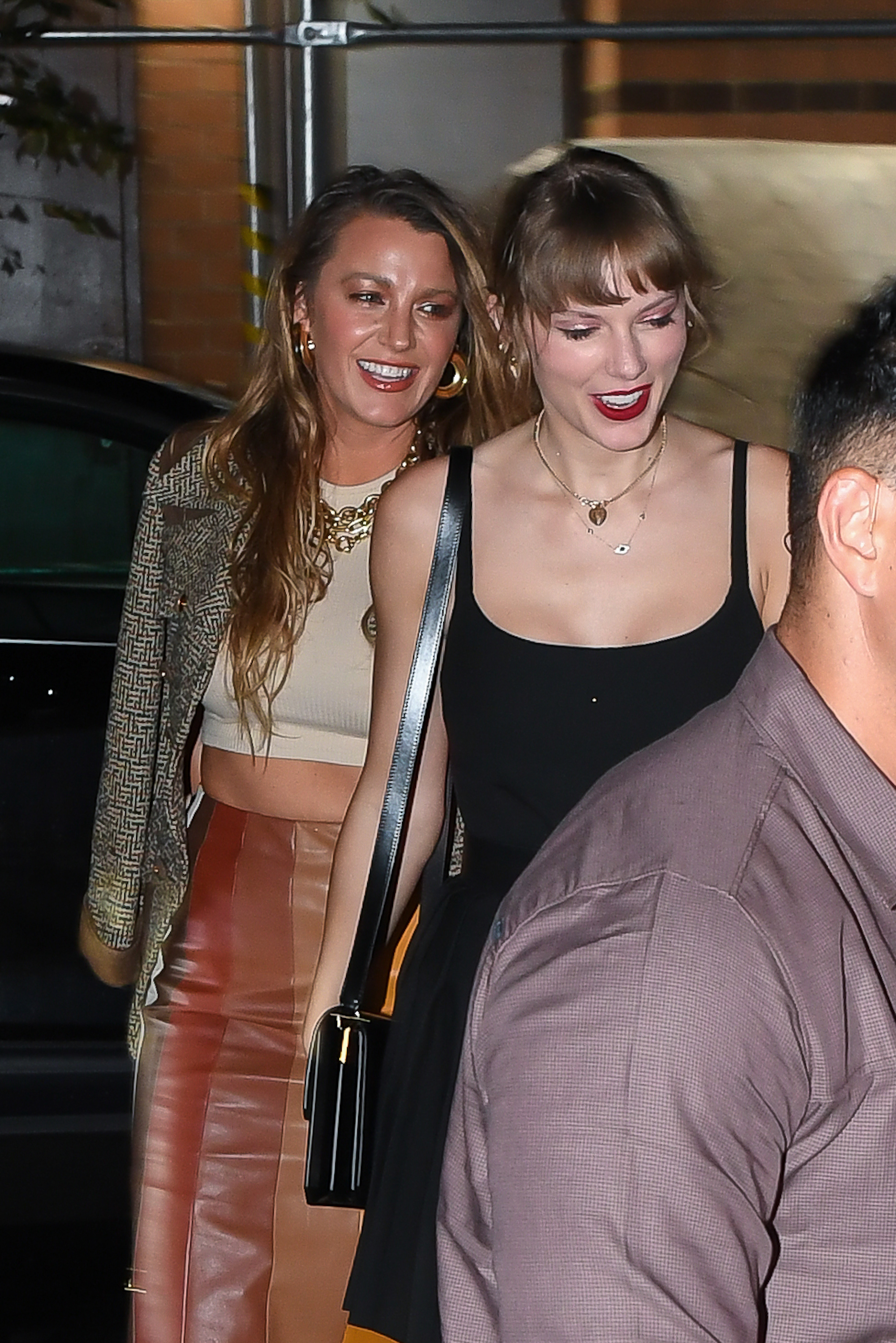 Blake Lively and Taylor Swift laugh. 