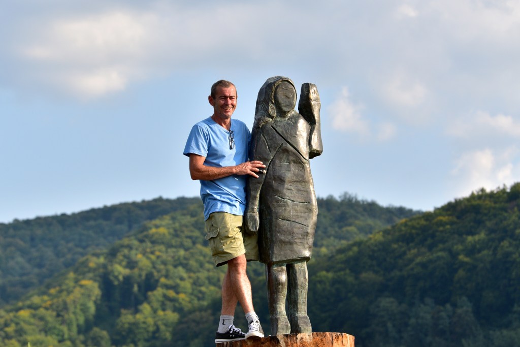 Ales 'Maxi' Zupevc, one of the artists of the statue, poses with his creation in Slovenia.